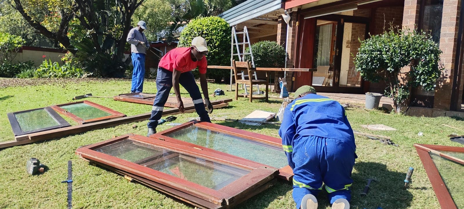 The Thakhama Group team restoring hardwood window frames on site